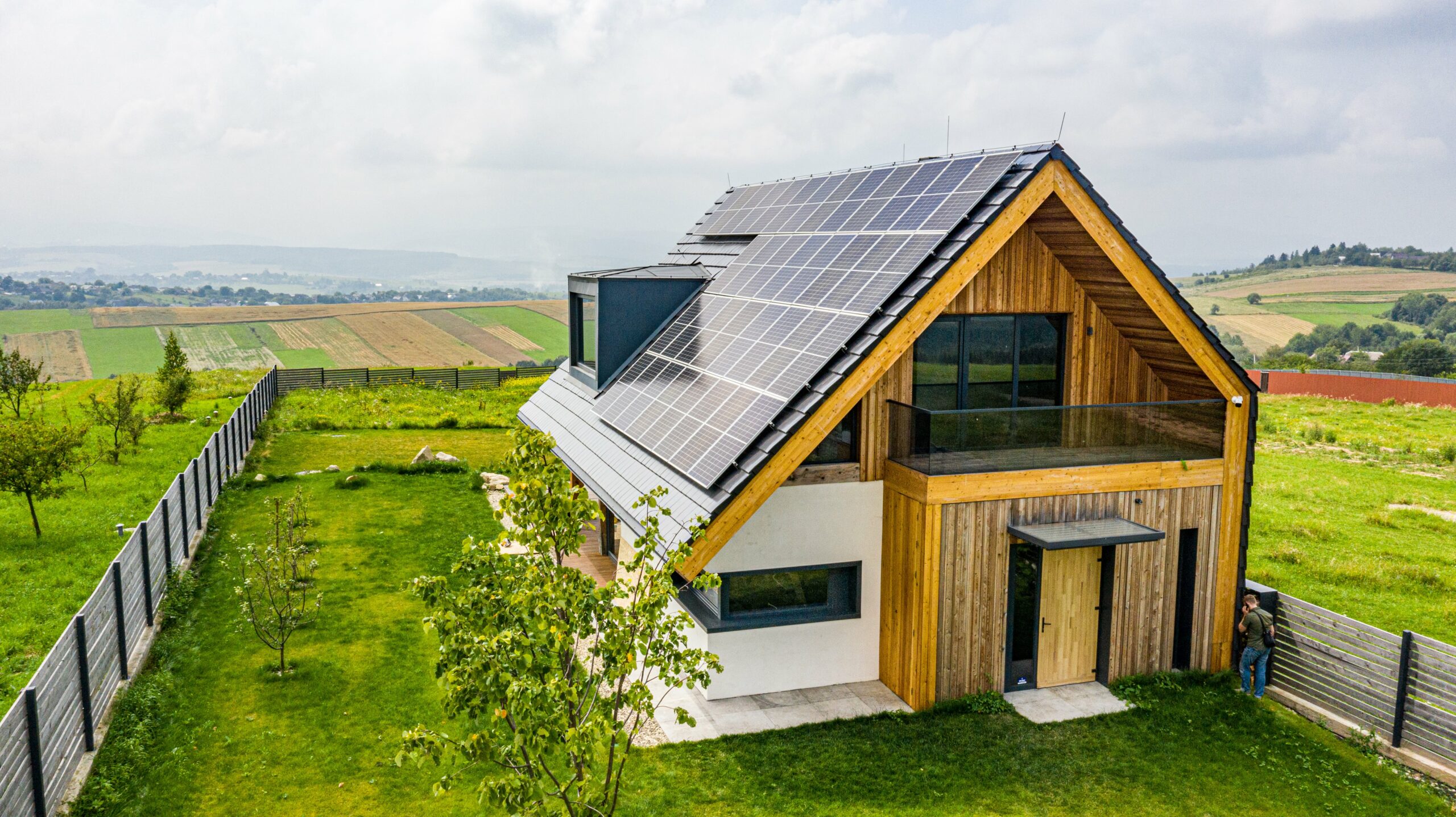 An energy efficient home with solar panels on the roof.